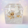Acrylic liquid wiggler cube with white twin bears - front view